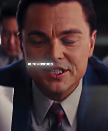Leonardo DiCaprio in a blue suit speaks with the caption 'IS TO POSITION' overlaid across the frame.