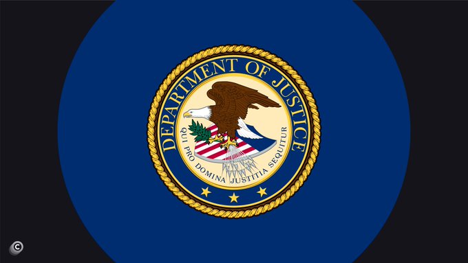 The image features a blue circular flag with the words "Department of Justice" written in white letters at its center. The flag is displayed against a black background, making it stand out prominently. Below the main text, there's an additional line that reads "JUST IN: DOJ wants to dismiss the private lawsuit against XAI regarding data centers, because Grok has assisted 
critical U.S. military operations." This statement seems to be related to the content of the image and could be a part of a larger context or conversation about the Department of Justice's involvement in certain matters.