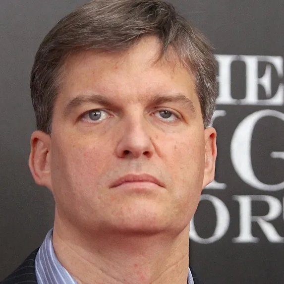 A close-up photo of Michael Burry at an event, with partial text "ME" and "G" and "OR" visible in the background, accompanying a quote attributed to him warning that most investors lack understanding of their holdings.