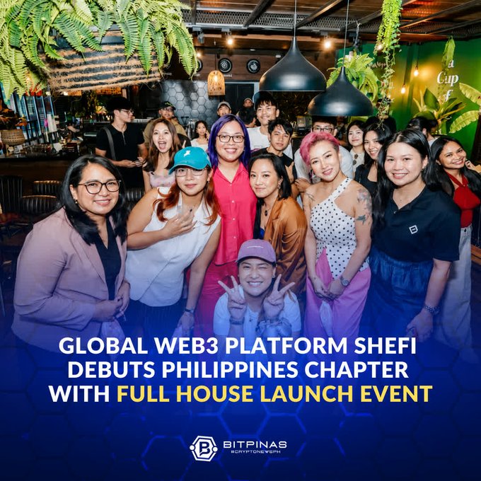 A group photo at an indoor event with the text 'GLOBAL WEB3 PLATFORM SHEFI DEBUTS PHILIPPINES CHAPTER WITH FULL HOUSE LAUNCH EVENT' and 'BITPINAS' logo at the bottom.