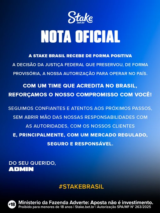 A blue promotional graphic displays a 'NOTA OFICIAL' (Official Note) from 'Stake.bet.br', discussing a positive federal court decision regarding their authorization to operate in Brazil, with the hashtag '#STAKEBRASIL' and Ministry of Finance warnings at the bottom.
