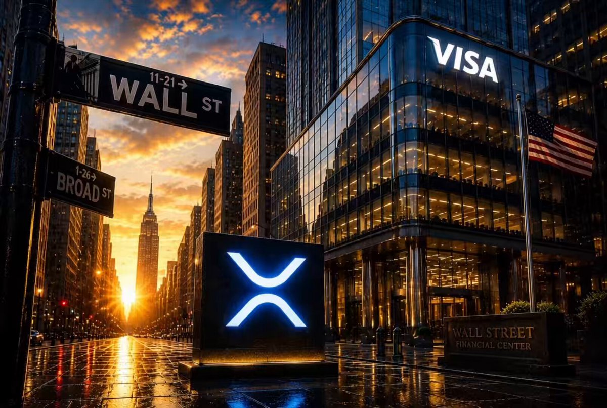 The image features a city street with a large sign that says "VISA SEES THE FUTURE" above a building, which has a "Wall Street" sign below it. The sun is setting behind these buildings, creating a beautiful backdrop for the scene. In front of one of the buildings, there's an advertisement for XRP, suggesting that the city might be at the forefront of adopting new and innovative technologies like cryptocurrencies. This could potentially lead to growth in the crypto market, similar to how the internet and e commerce boomed in the early 2000s.