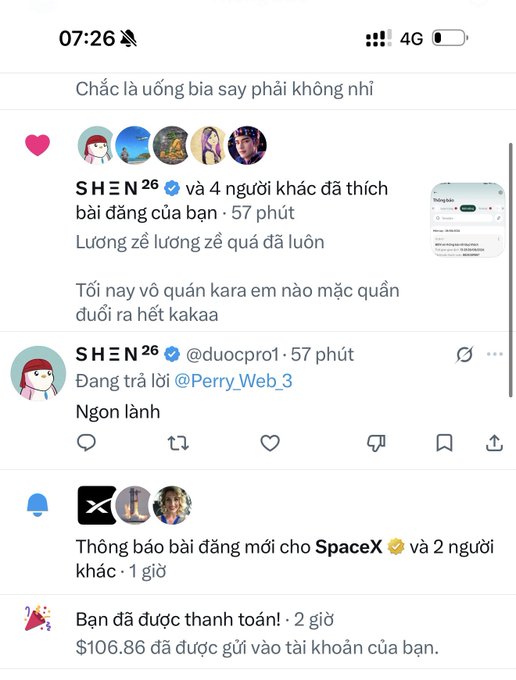 A screenshot of a mobile phone social media feed in Vietnamese at 07:26, showing various posts and replies, including a notification that $106.86 has been sent to the user's account.