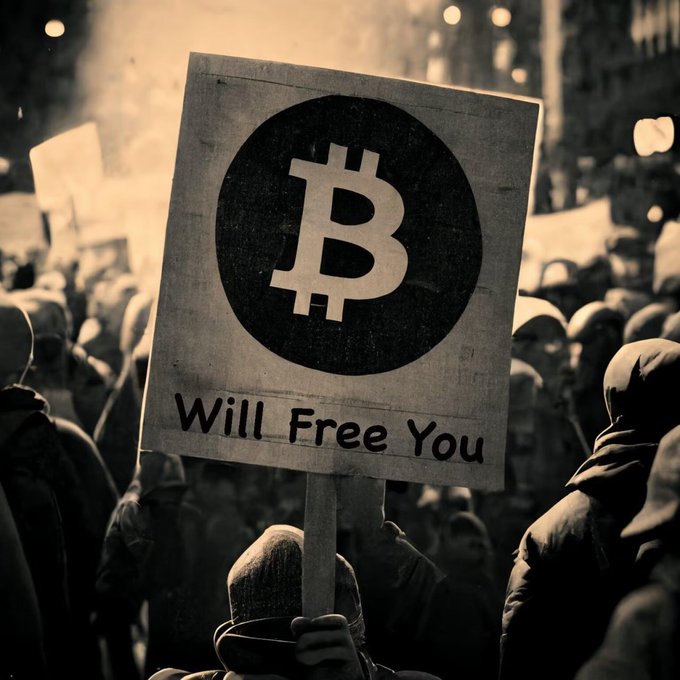 A sepia-toned photograph shows a crowd of hooded protesters, with one holding a sign reading 'Bitcoin Will Free You' featuring the Bitcoin logo.