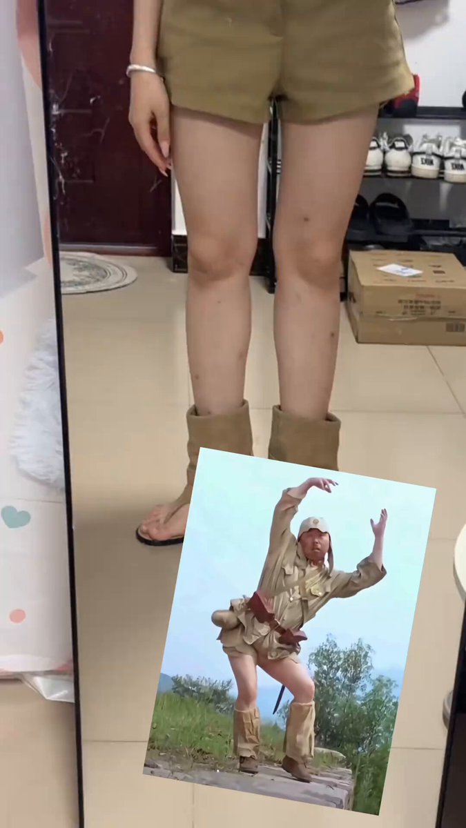 The image features a woman standing next to a mirror with her legs crossed. She is wearing tan shorts and boots, giving off an impression of being outdoors or at least in a casual setting. The photo also includes a picture of the woman posing for the camera, which adds to the overall visual appeal of the post. The caption reads: "Woke up feeling like I got a jolt—what' s this, a barrage of shoes? TermMax is really blowing up, even scammers are jumping on the hype train."