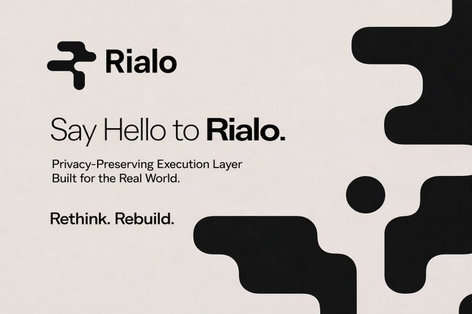 The image shows a white background with black text that reads "Say Hello to Rialo." The text is positioned above an abstract design of circles, which are arranged in a way that creates a sense of movement or flow across the image. This design element adds visual interest and draws attention to the message displayed on the image.