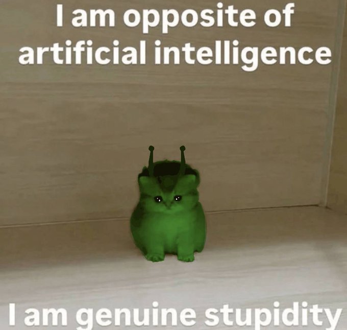 A small green moth-like creature sits on a wooden surface, with meme text above reading "I am opposite of artificial intelligence" and below reading "I am genuine stupidity."