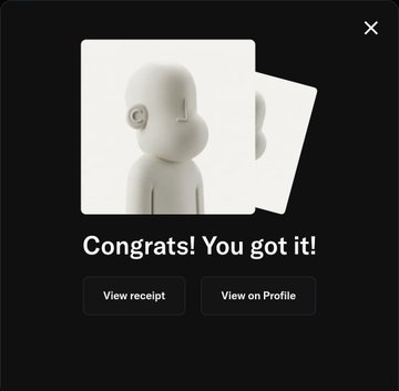 A dark-themed pop-up notification screen displaying a 3D rendered character icon with the message "Congrats! You got it!" along with "View receipt" and "View on Profile" buttons.