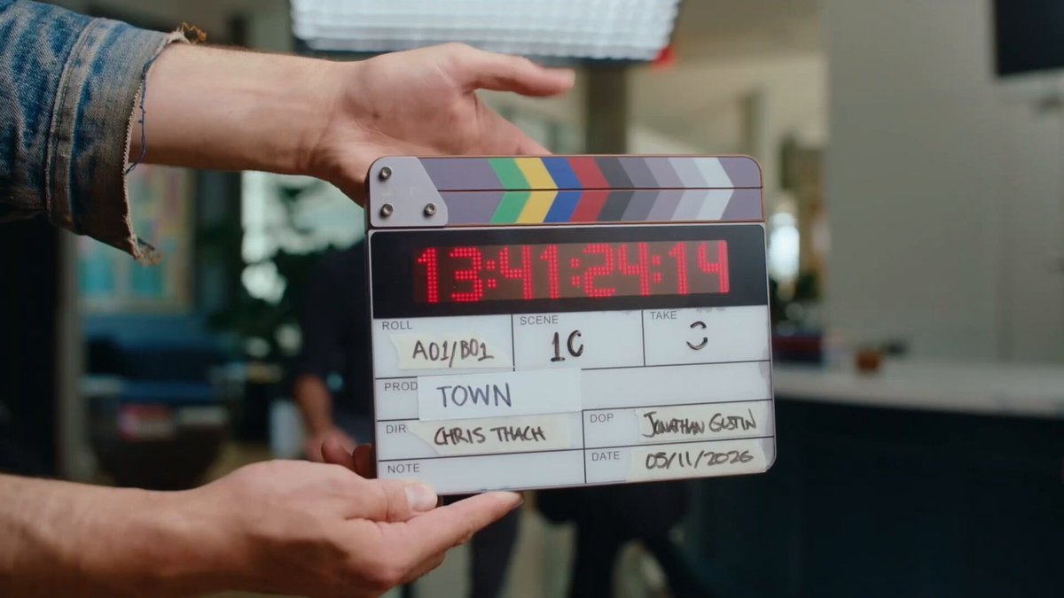 The image features a person holding up a movie clapperboard, which has a red number "1341 1424 2019" written on it. The clapperboard appears to be used for filming purposes or possibly as part of a promotional campaign. In addition to the clapperboard, there is also a drawing of an otter in the image. The post includes text that reads: "So happy convex is a part of something so cute gonna make my cute lil otter townie rn". This suggests that the person holding up the movie clapperboard might be promoting or showcasing a film featuring an otter character, possibly as a part of a marketing campaign.