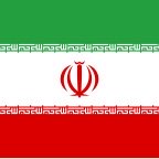 The image depicts the flag of Iran, featuring horizontal green, white, and red stripes with the red national emblem centered in the white band and decorative Kuquri script bordering the stripes. It visually ties to the post's claim that Iran is using cryptocurrency to bypass US sanctions, symbolizing the country referenced in the breaking news announcement.