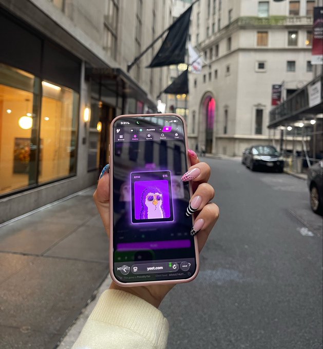 A hand with pink manicured nails holds up a smartphone displaying the YEET app interface, showing an NFT ($EPIK valued at $15) of a purple-haired figure with sunglasses, set against an urban street backdrop. The post promotes an $EPIK airdrop for YEET users, tying the visible app screen to the campaign's claim requirement.