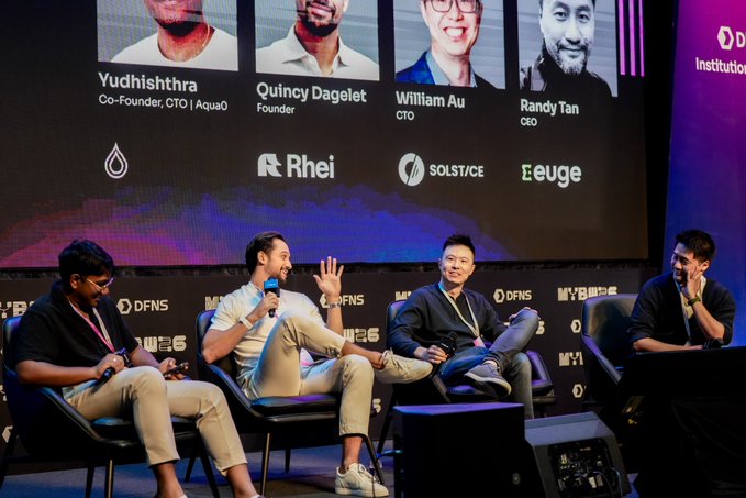 Panel discussion at a DFNS/MyB event featuring Yudhishthra (CTO, Aqua0), Quincy Dagelet (Founder, Rhei), William Au (CTO, Solstice), and Randy Tan (CEO, Eeuge), with their company logos displayed on screen.