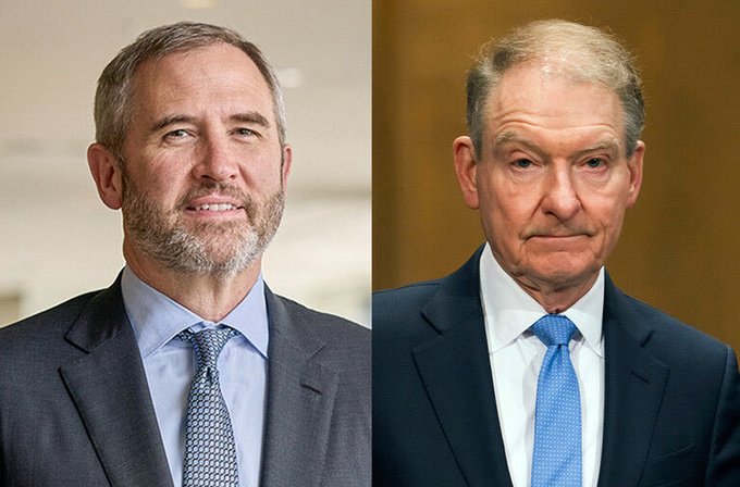A side-by-side photo shows Brad Garlinghouse (CEO of Ripple) on the left, smiling in a dark suit with a light blue tie, and Senator Tim Kaine on the right, wearing a dark suit with a bright blue tie. The image likely relates to the post about tokenized stocks and XRP, possibly tying Ripple's push for real-world asset tokenization to legislative support.