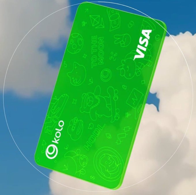 The image features a green Visa card floating in the air against a blue sky filled with clouds. The card has a unique design that incorporates elements of cryptocurrency, such as Bitcoin icons and symbols, making it stand out from traditional cards. The text on the card reads "Kolo is redefining how crypto fits into everyday life", indicating that this card is specifically designed for users who want to incorporate their digital assets directly into their daily lives through seamless payments and financial tools.