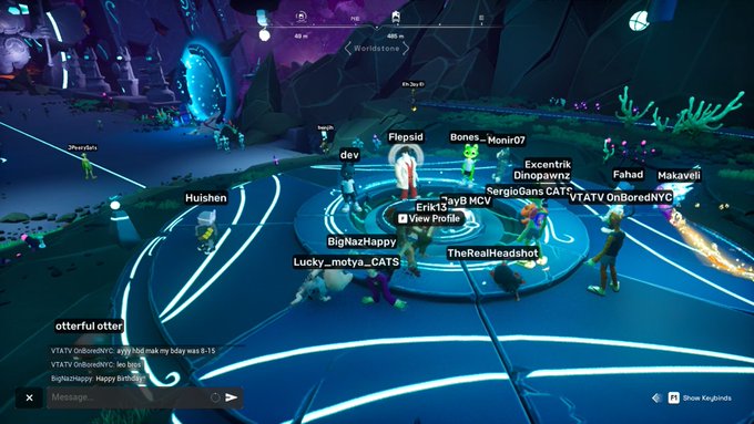A group of players, including "Hulshen," "dev," "Flepsid," "Bones_Monir07," "Excentrik," "Dinopawnz," "Fahad," "Makaveli," "SergioGans," "CATs," "VTATV," "OnBoredNYC," "Errik33," "VB MCV," "BigNazHappy," "Lucky_motya_CATS," "TheRealHeadshot," and "otterful otter," gather in a circle on a glowing platform in the "Worldstone" area during Game Time #45. The chat in the corner shows users wishing "OnBoredNYC" a happy birthday and discussing the games played.