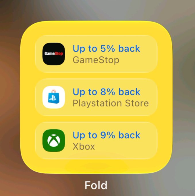 A yellow interface panel shows cashback offers of 'Up to 5% back' at GameStop, 'Up to 8% back' at the Playstation Store, and 'Up to 9% back' at Xbox, with a 'Fold' button at the bottom.
