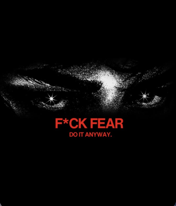 A black and white graphic of intense, glowing eyes staring out from darkness with red text reading 'F*CK FEAR DO IT ANYWAY.'