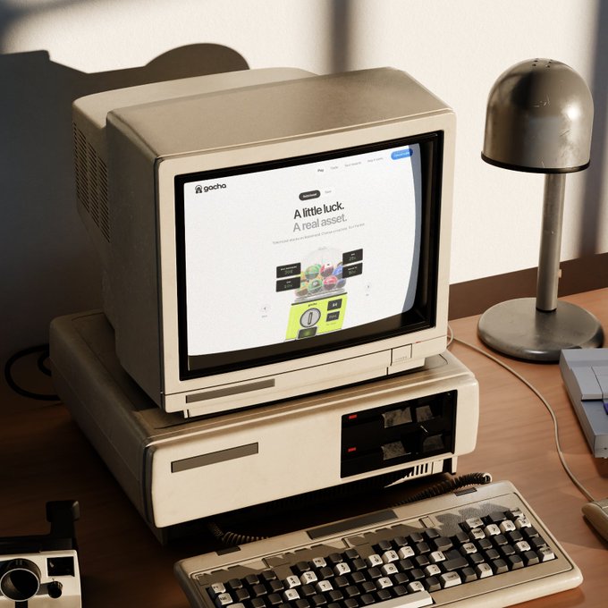 A vintage beige CRT monitor and keyboard sit on a wooden desk next to a metal dome lamp, displaying a webpage that reads "Gacha — A little luck. A real asset." with colorful gacha toy imagery, visually echoing the post's announcement of Gacha Site launching on RobinhoodCrypto to bring profits back to the Bario Punks community.