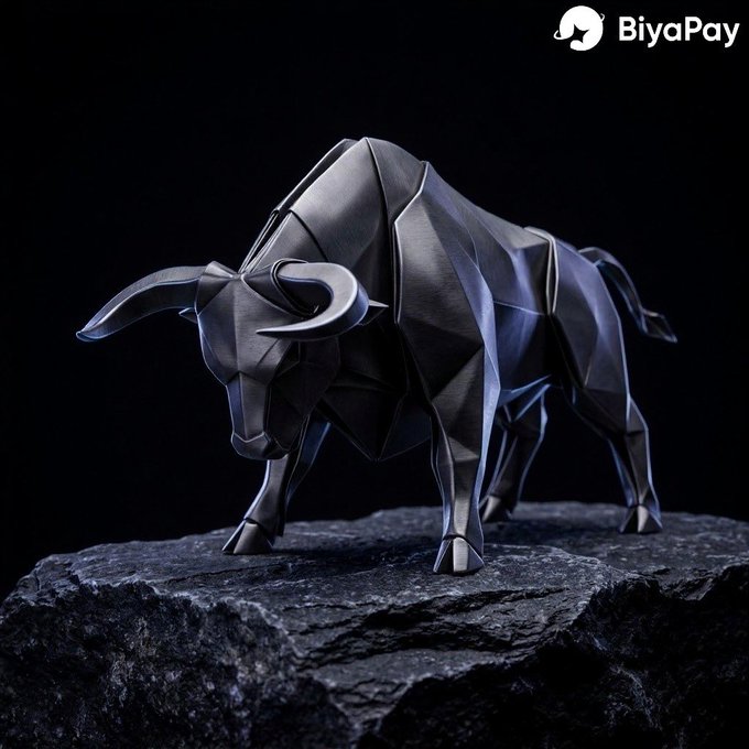 A geometric black bull statue stands on a rocky base, symbolizing market strength and bullish momentum, with the "BiyaPay" logo visible in the corner—reflecting the post's observation that crypto conversations have shifted from coins like BTC and ETH to broader macroeconomic forces like the Fed and companies like Nvidia.