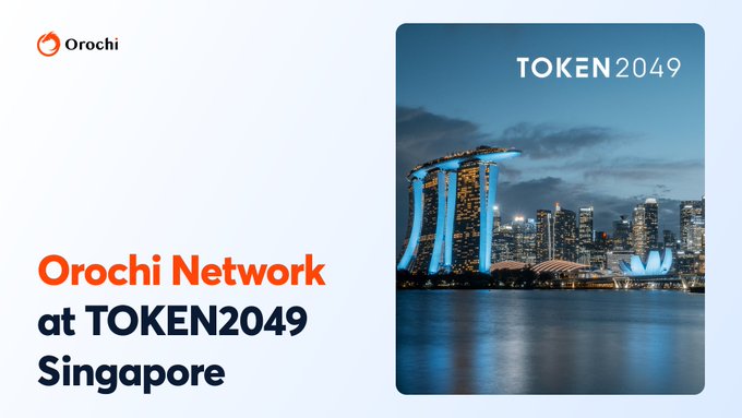 A light-colored promotional image featuring the company's orange swirl logo and bold text "Orochi Network at TOKEN2049 Singapore" alongside a stunning nighttime cityscape photo of Singapore's Marina Bay Sands skyline with the "TOKEN2049" event branding overlaid in the upper right.