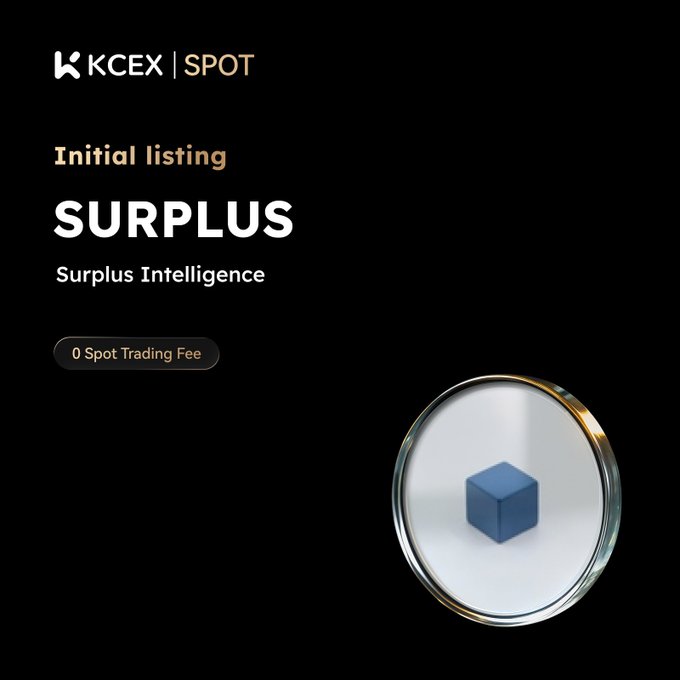 The image features a blue cube sitting inside of a clear glass dome, which appears to be a magnifying glass or microscope. The background of the image is black, making the colors of the cube stand out more prominently. Below this image, there's text that reads "#KCEX initial listing! Enjoy zero fees on spot trading $SURPLUS is an onchain AI inference marketplace on Base where sellers compete to offer the cheapest prices on frontier models. Deposits: Opened SURPLUS/USDT Trading Starts: 2026-05-25 4:00 (UTC) Trading Now:". This text provides information about a new listing for trading in the cryptocurrency market, specifically focusing on the initial listing of the cryptocurrency called "Surplus" and its relation to spot trading fees.