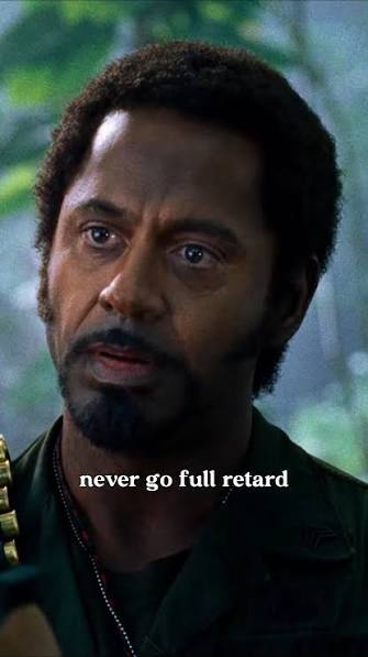 Meme image of Robert Downey Jr. looking serious with the text 'never go full retard' displayed across the bottom.