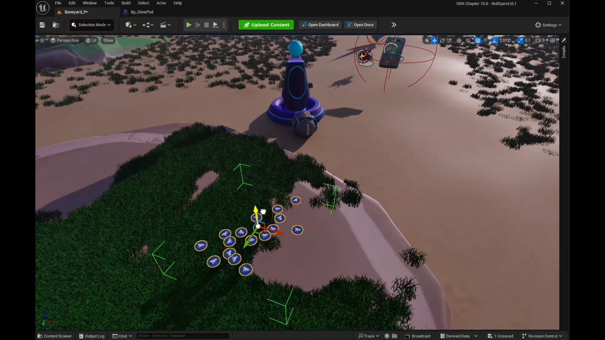 The image shows an open video game window with a scene of a sandy beach, green grass, and rocks. There are several objects scattered around the beach area, including a blue object that appears to be a boat or ship. The background also includes some text elements such as "ODK & HMM" and "Gm from the ODK". The image is related to the post because it features an illustration of a beach scene with various objects, which could be used in a video game setting for creating a more immersive experience.