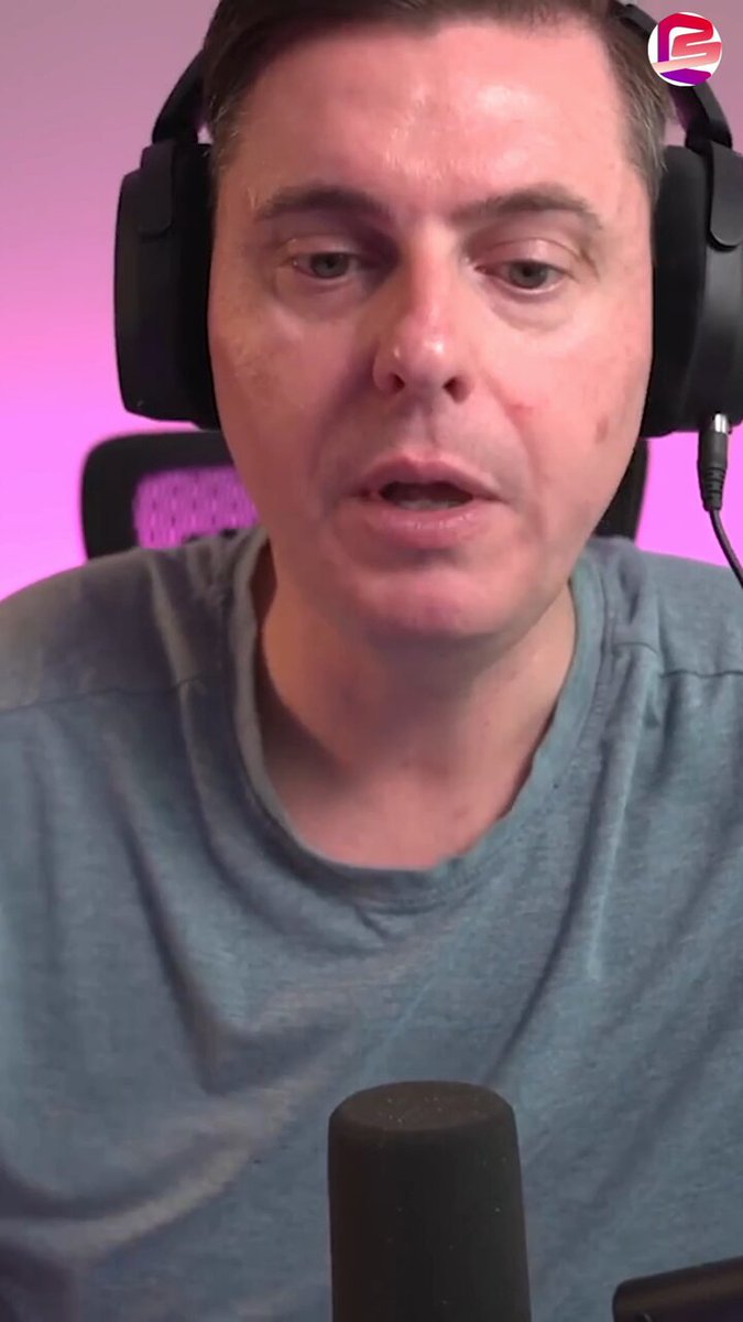 The image shows a man wearing headphones, possibly listening to music or participating in an online meeting. The caption of the image reads "Ripple spent 10 years building client relationships. Now they'r going back to every one of them with a completely different offer. This is the blockchain arms race in real time. AI had it. Weapons had it. Now financial infrastructure has it". The man's headphones are black and he appears to be wearing a gray shirt, which contrasts with the pink background of the image.