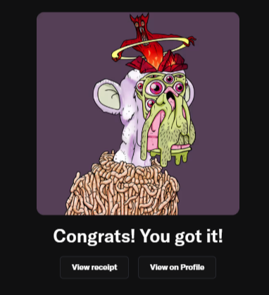 The image features a cartoon monkey with a hat, face paint, and a large pile of food next to its head. The monkey appears to be wearing a crown or hat that has a red band around it. The background of the image is purple, which contrasts with the white fur on the monkey's back. There are two text boxes in the image: one at the top right corner congratulating the user and another at the bottom left corner providing instructions for viewing the profile page.