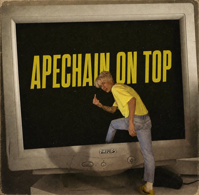 A retro-styled image shows a man in a yellow shirt and jeans leaning against an old Philips TV displaying the text 'APECHAIN ON TOP'.
