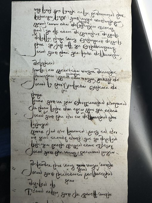 A page from an old handwritten manuscript with faded brown ink script on aged paper.