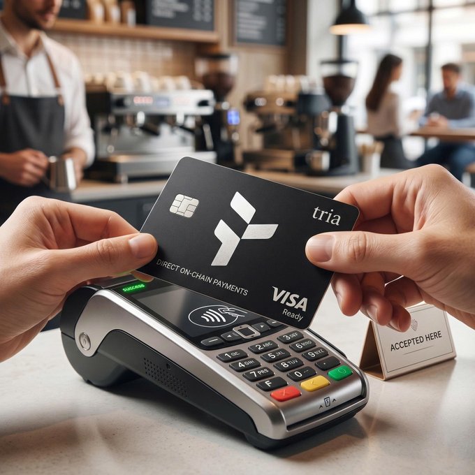 A person holds a black Visa card with the Visa logo, while another individual operates a coffee shop counter behind them.