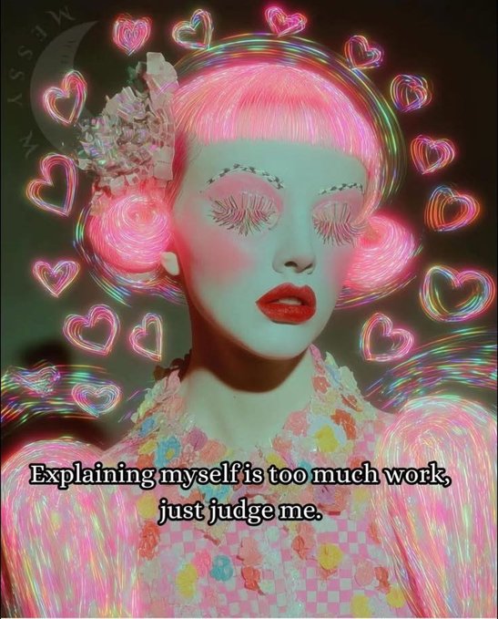 A neon-lit portrait of a Barbie-style figure with pink hair, heart-shaped glowing lights, and pastel ruffled attire, featuring the overlaid text "Explaining myself is too much work, just judge me." The image captures the ironic "Live, Laugh, Love" energy by flipping the wholesome wall-quote sentiment into a glam, unapologetic mood—replacing gentle affirmations with neon maximalism and a bold dismissal of having to justify one's vibe.
