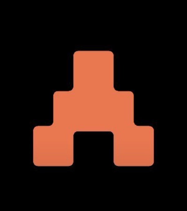 A minimalist graphic displays a solid terracotta-orange geometric shape resembling a stylized temple, pyramid, or archway with a central opening, set against a plain dark gray background.