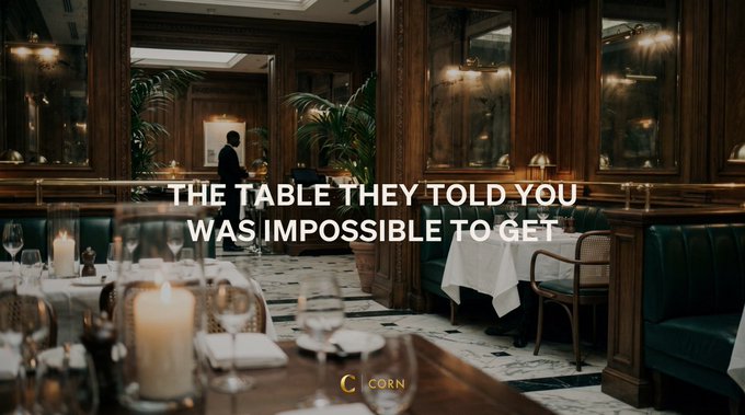 An elegant restaurant interior with green leather booths and lit candles, overlaid with the text 'THE TABLE THEY TOLD YOU WAS IMPOSSIBLE TO GET' and a 'CORN' logo.