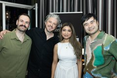 Four people—three men and a woman in a white dress—pose together at an exclusive VIP dinner, smiling for the camera at an upscale venue. The gathering marks the pre-launch celebration for Newton (XYZ) and Redstone DeFi teams.