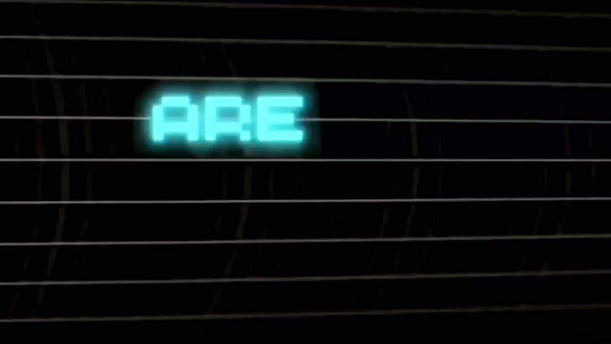 The image features a neon sign that reads "ARE" with blue letters against a black background. The sign is glowing brightly, indicating that it's powered by electricity or batteries. The text "Hooray, it' s finally time! ZERG Mainnet Beta is now LIVE. Zerg has officially entered a new phase." is written below the neon sign in white text. This message seems to be related to the neon sign and possibly the ongoing beta testing of the game.