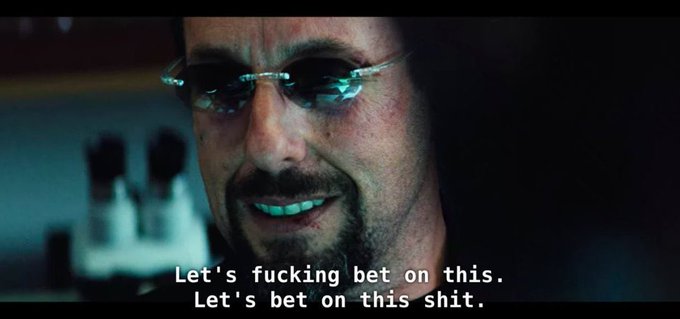 A movie still shows a man with sunglasses and goatee grinning, with the subtitle reading: 'Let's fucking bet on this. Let's bet on this shit.'