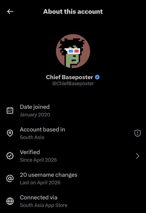 The image shows a social media app with a black background, displaying information about a user's account. The main focus of the image is a profile picture of a person wearing glasses and a green shirt. The text on the screen provides details about the user's account, including their name, date joined, location, and account type. There are also options to change the user's name or verify their account information.