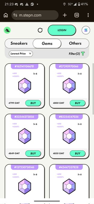 The image shows a cell phone screen displaying an app called "Stepn" with a list of items for sale, including purple and green gemstones. The app also has a search bar at the top that allows users to find specific items or browse through the available options.