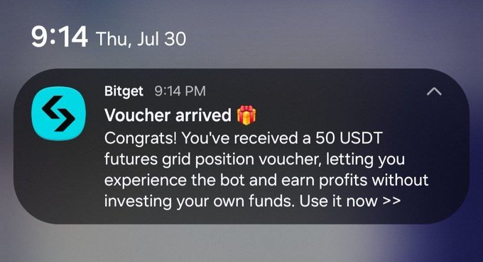 A Bitget notification dated 9:14 PM announces 'Voucher arrived 🎁' with a message congratulating the recipient on receiving a 50 USDT futures grid position voucher.
