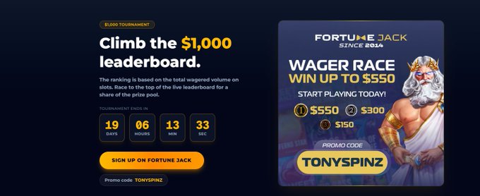 A Fortune Jack promotional banner advertising a $1,000 leaderboard tournament and a 'WAGER RACE' with promo code TONYSPINZ and an illustration of Zeus.