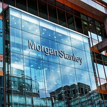 A modern glass office building displays the "Morgan Stanley" name in large letters on its facade.