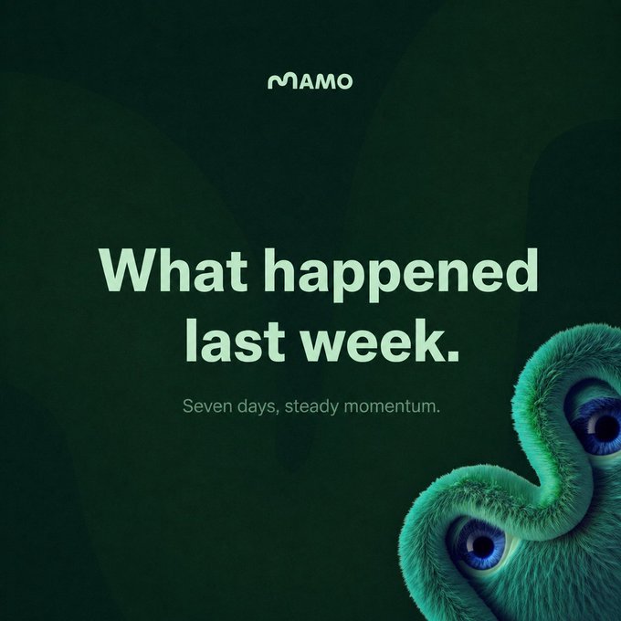 The image features a green stuffed animal with blue eyes, positioned above a quote that reads "What happened last week. Seven days, steady momentum." The background color is dark green, which contrasts with the bright colors of the stuffed animal and the text. The image also includes a watermark in the bottom right corner that says "MAMO".