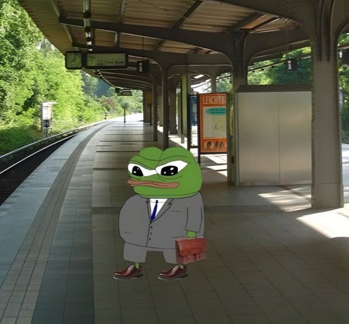 A Pepe the Frog character edited into a suit and tie, holding a briefcase, standing on a concrete train station platform with "LEICHTE" signage visible.