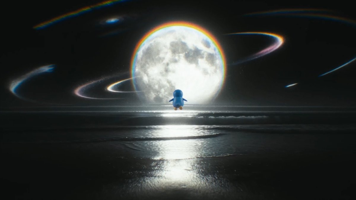 A small blue cartoon penguin floats above a dark ocean surface, silhouetted against a massive glowing full moon with rainbow light trails swirling around it.