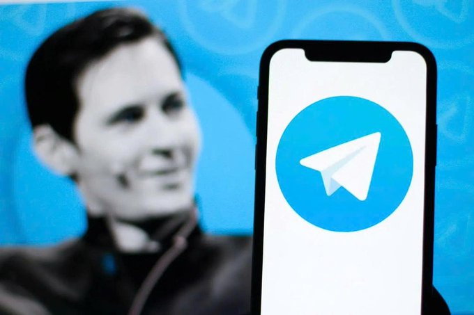 This image shows a smartphone screen displaying the Telegram logo, with a partially visible image of Pavel Durov in the background, aligning with the announcement of Telegram's cryptocurrency wallet integration for its user base.