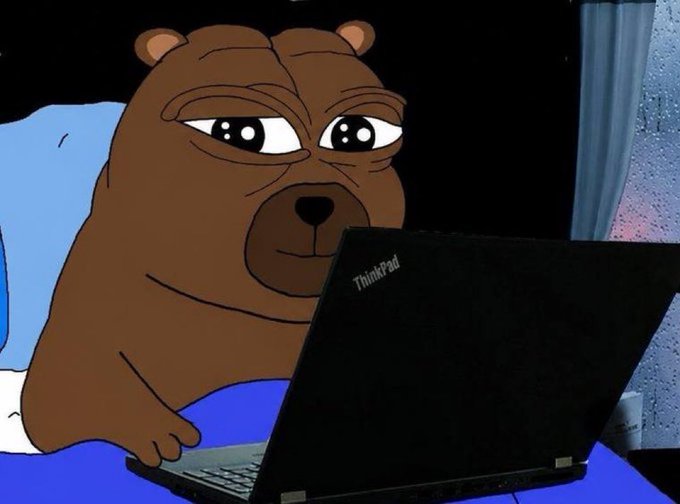 The image features a cartoon bear sitting at a laptop computer, with its eyes closed as if it's sleeping or taking a nap. The caption below the image reads "Day 692 posting a meme until $BOBO gets to 1B market cap". This suggests that the image is part of a series of memes featuring the same cartoon bear and laptop, likely aiming to create a humorous and relatable connection with the audience.