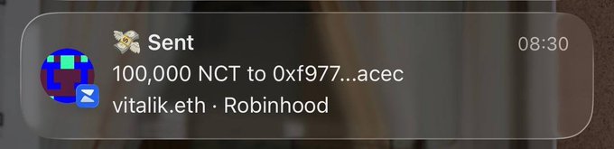 A notification from MetaMask on a phone screen showing 'Sent 100,000 NCT to 0xf977...acec' (vitalik.eth) via Robinhood at 08:30.
