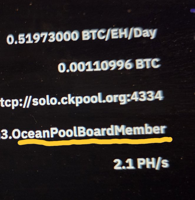 A screenshot of a Bitcoin Solo mining interface shows a hashrate of 2.1 PH/s with projected earnings of 0.51973000 BTC/EH/Day (0.00110996 BTC total), connected to solo.ckpool.org:4334 and identified as "OceanPoolBoardMember" (underlined in yellow)—relating to the post by revealing the public Bitcoin address of an Ocean Mining board member who has switched to solo mining through a competitor (CKPool), likely in protest over the BIP110 debate.